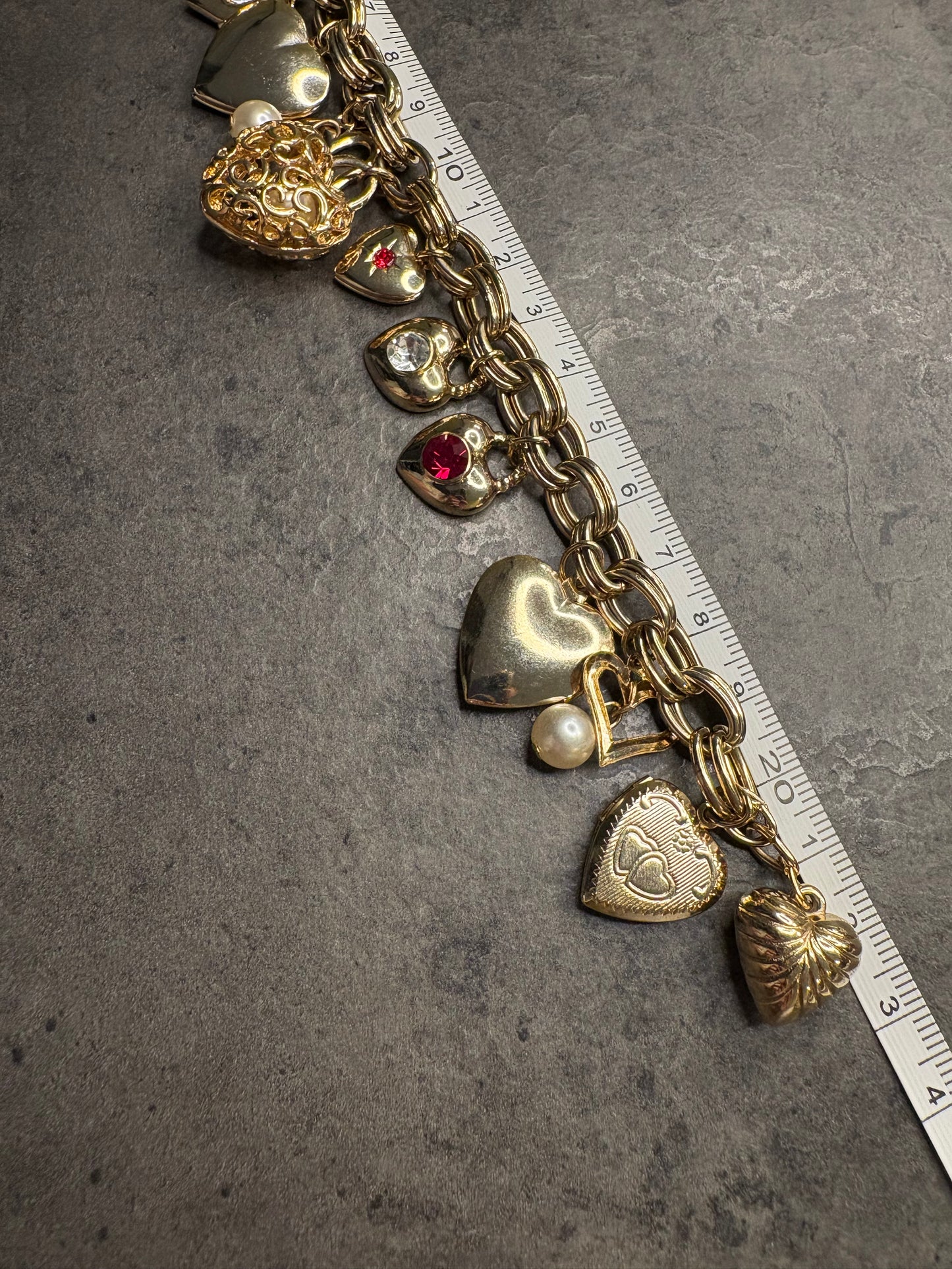 Bracciale vintage con charm a cuore e locket