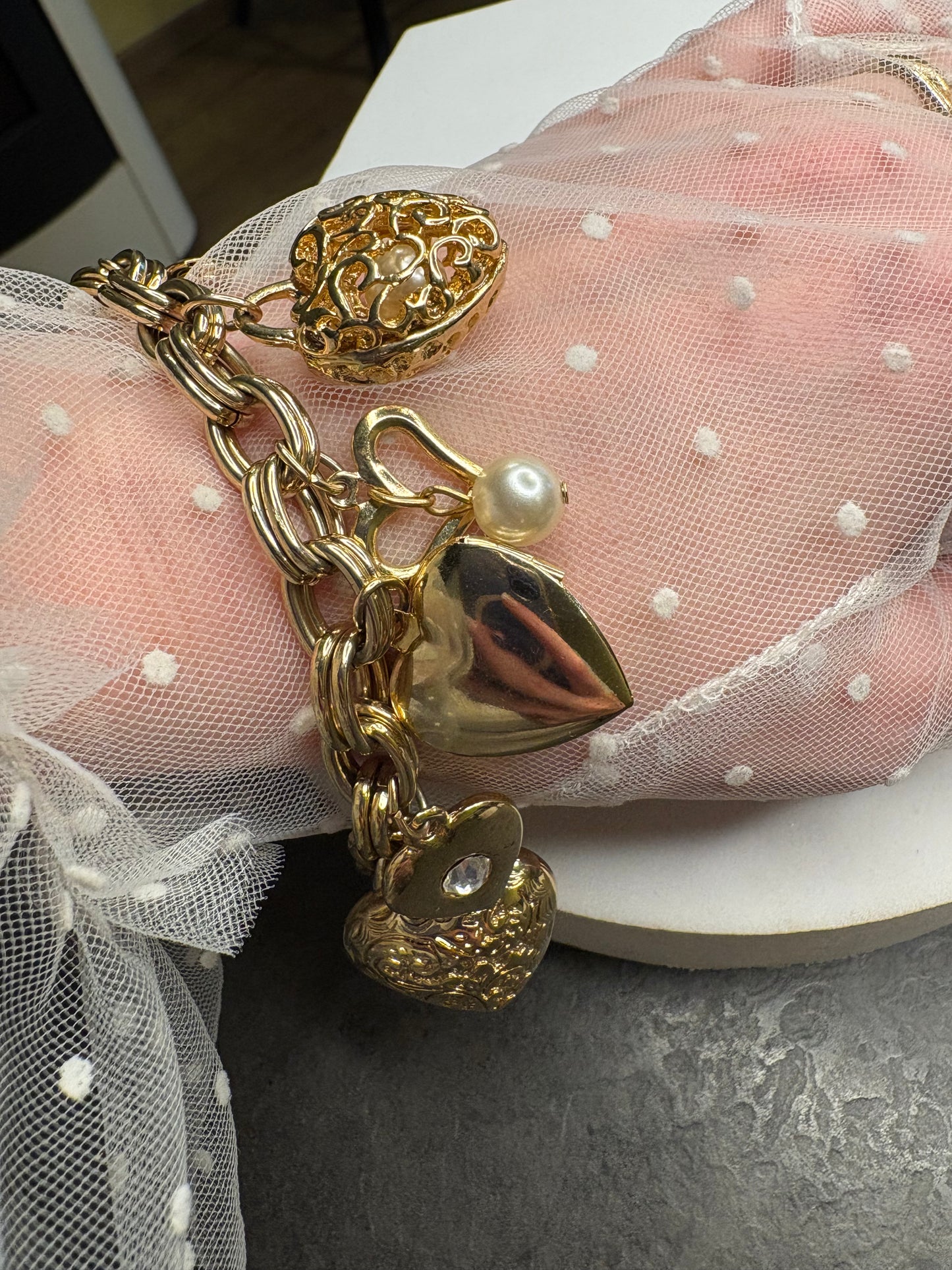 Bracciale vintage con charm a cuore e locket